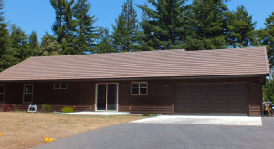 brown house with a clear view of the roof