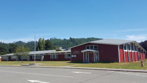 a wide show of a school front - red building